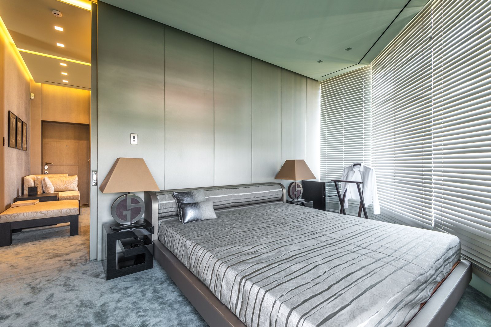 Contemporary bedroom with window blinds
