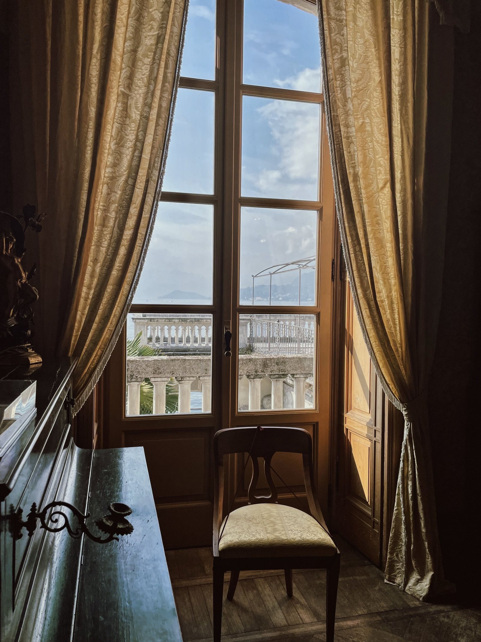 Curtains framing a tall interior window