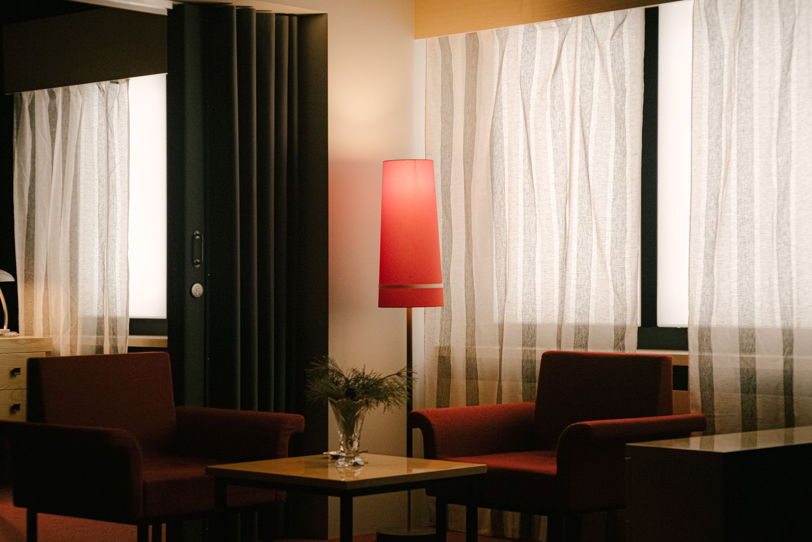 Commercial interior with layered window treatments