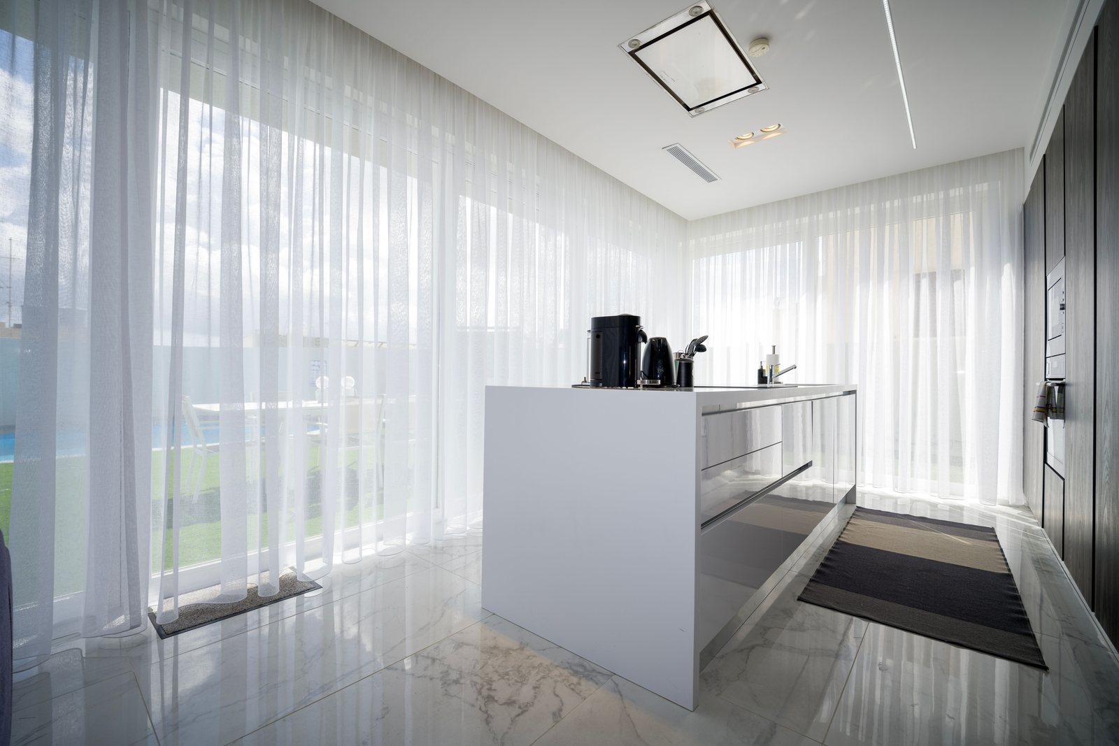 Sheer curtains filtering daylight in a contemporary interior